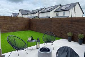 Porcelain paving Rosemary Artificial grass and contemporary fencing Kilcock from project Artificial grass